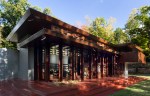 Frank Lloyd Wright's Usonian-style house features expansive glass walls for nature views
